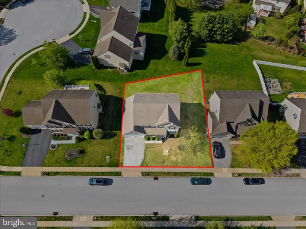an aerial view of house with a yard