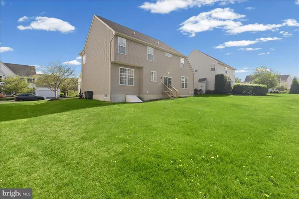 a view of a backyard of the house