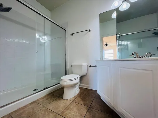 a view of a room with wooden floor and window