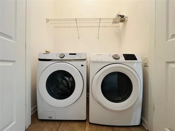a view of a house with backyard porch and sitting area