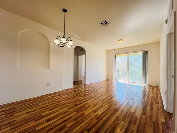 a view of a livingroom with wooden floor