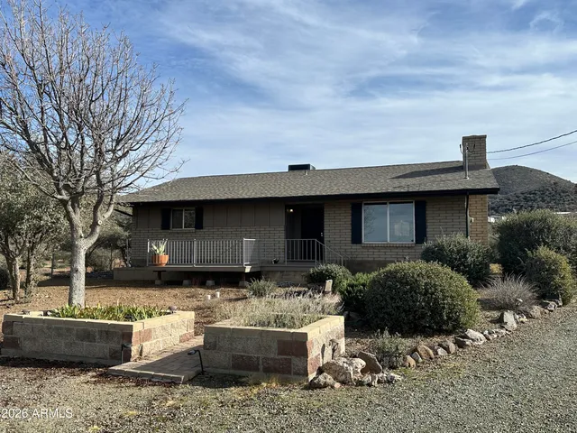 a front view of a house with garage