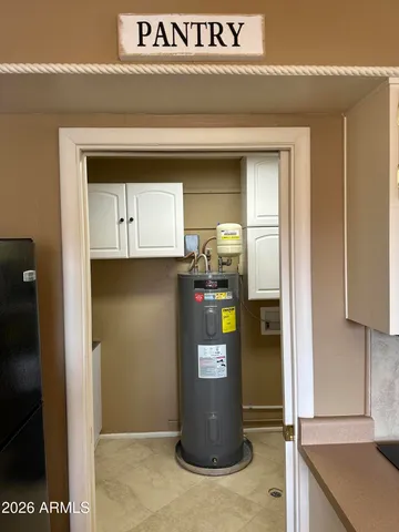 a kitchen with stainless steel appliances granite countertop a refrigerator sink and cabinets