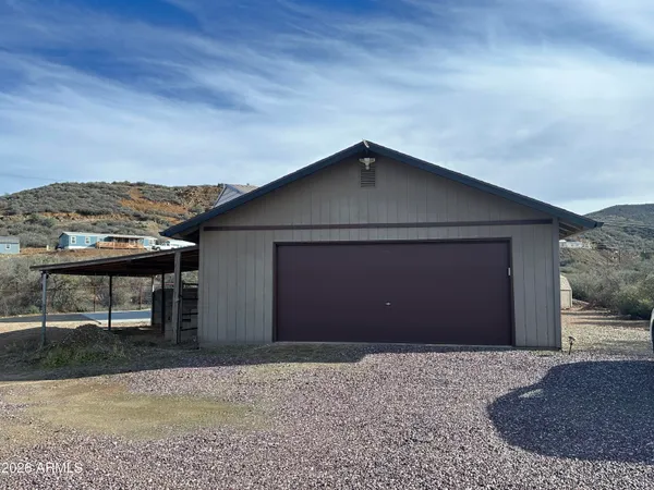 a bathroom with a sink a mirror and a shower