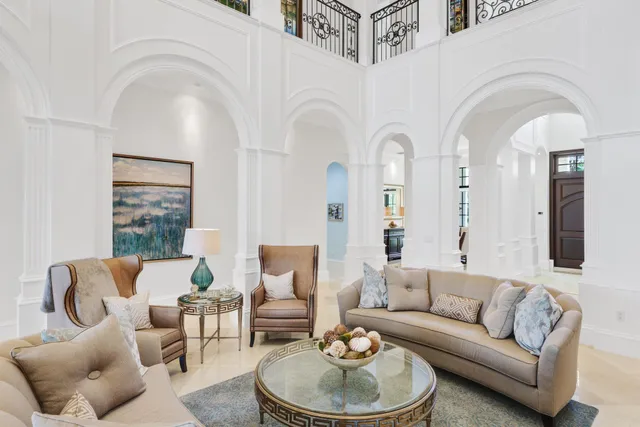 a spacious bathroom with a tub sink and mirror