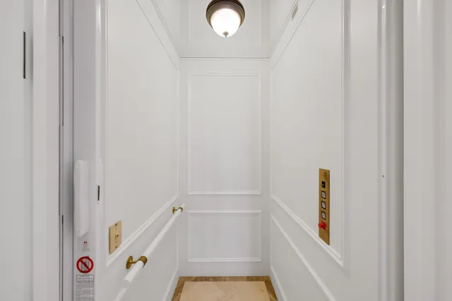 a view of a balcony with wooden fence
