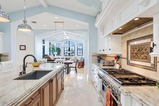 a spacious bedroom with a bed a couch and a table