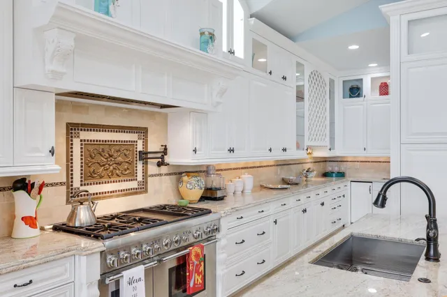 a bathroom with a sink mirror and vanity
