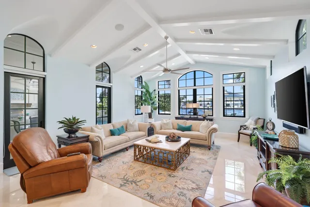a view of a patio with table and chairs and potted plants