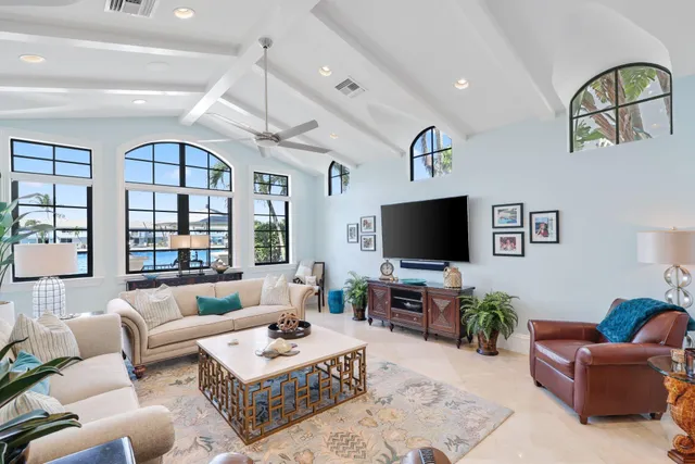a view of a patio with a table and chairs under an umbrella