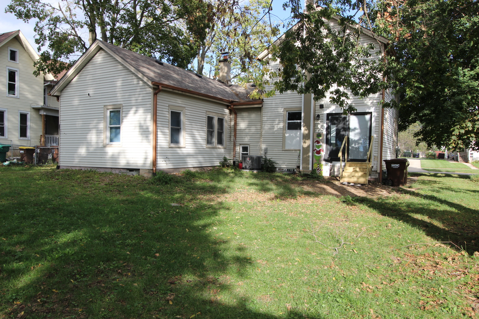 633 1/2 Whitney Boulevard Belvidere, IL 61008 - Photo 16 of 16 a front view of house with yard and trees in the background