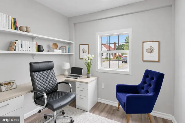 a work room with furniture and a window