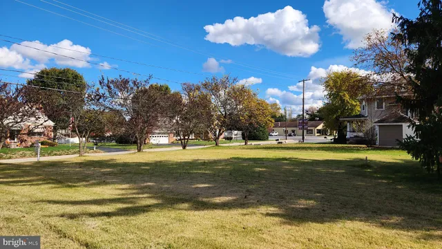 a view of a building in the middle of a building with a big yard