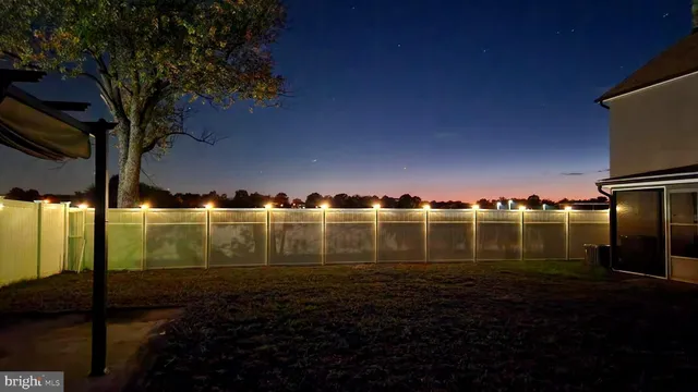 a view of a back yard of the house and green space