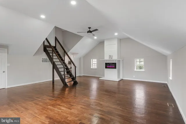 a view of an entryway with wooden floor