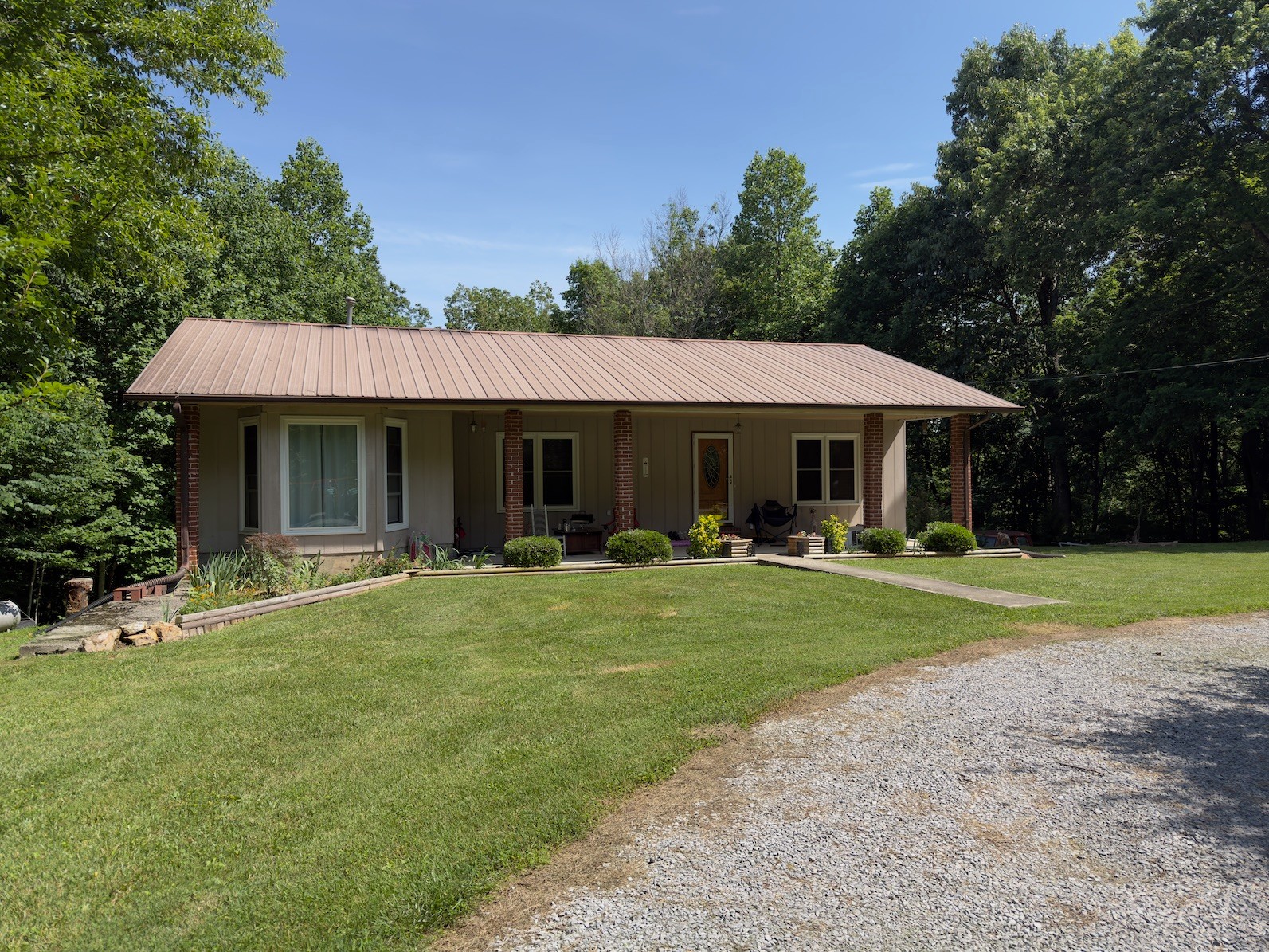 3080 Pleasant Ridge Road Woodbury, TN 37190 - Photo 2 of 19 a front view of a house with a yard porch and outdoor seating