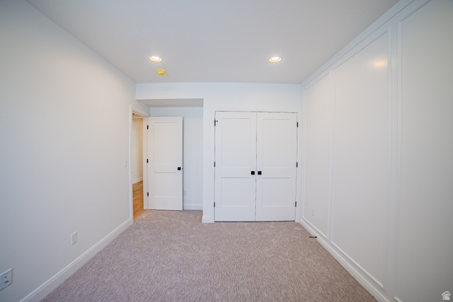 45 North Scarlet Maple Road, Unit 4317 Vineyard, UT 84059 - Photo 34 of 35 Bright interior room featuring a neutral carpet, recessed lighting, and a white paneled accent wall