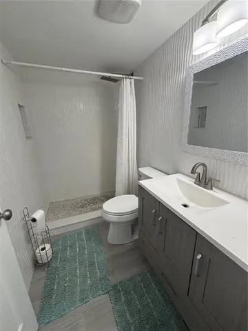 a view of storage and utility room with washer and dryer