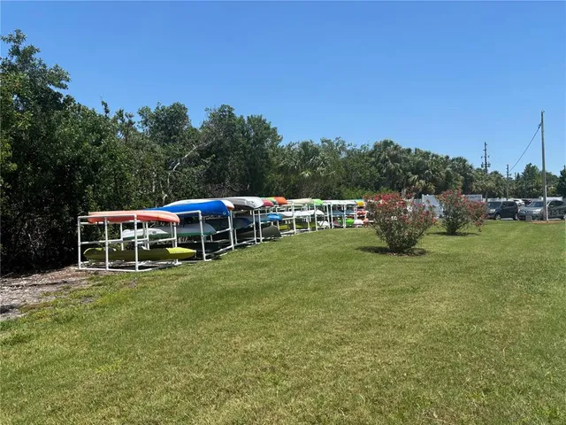 a view of a lake with houses in the back