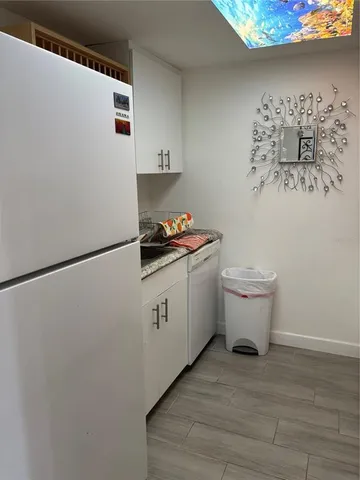 a view of a room that has a table and chairs in it