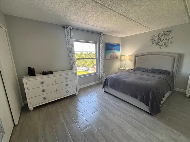 a kitchen with a refrigerator and cabinets