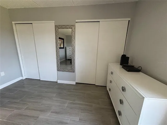 a bathroom with a double vanity sink mirror and toilet