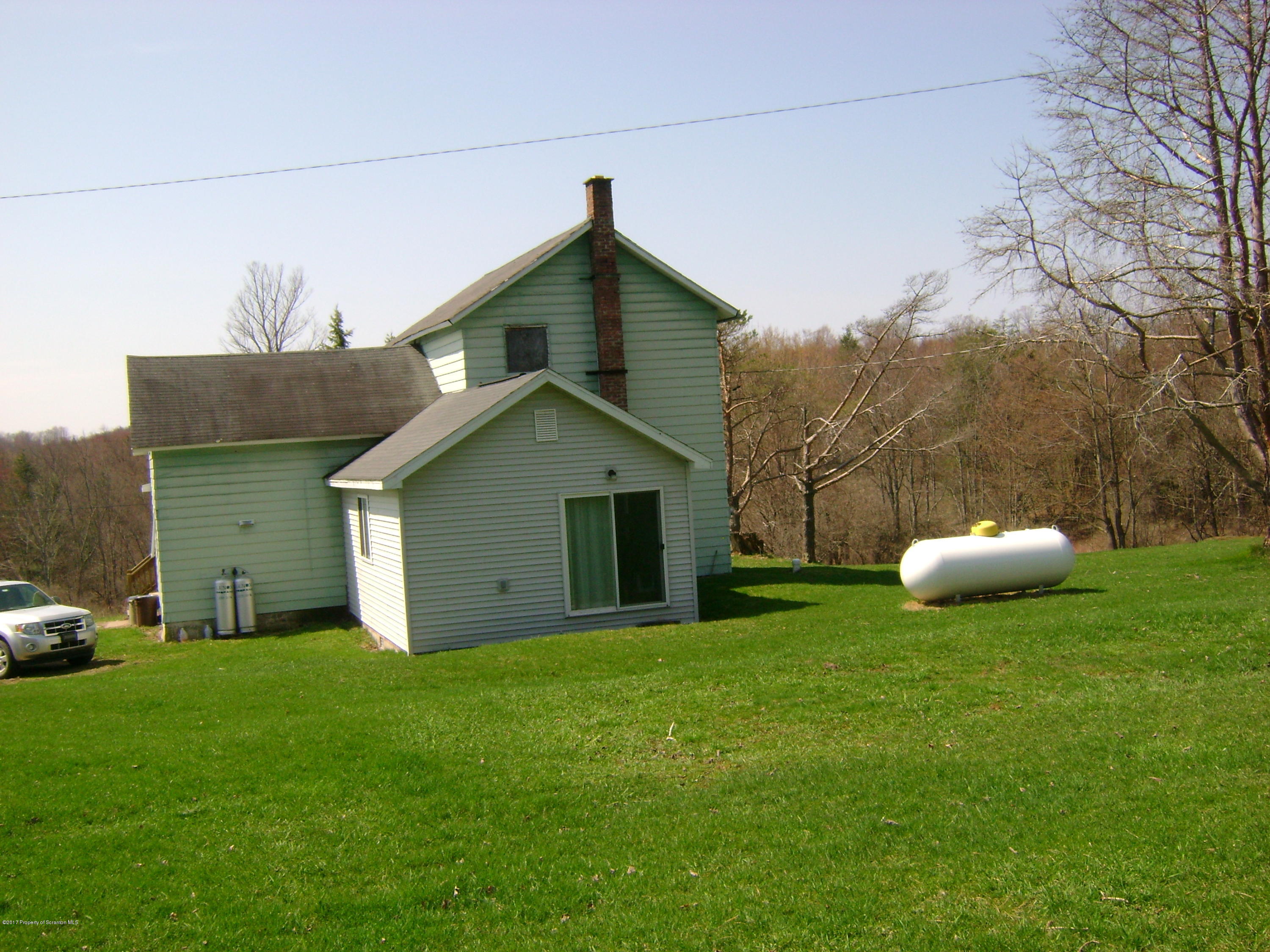 14879 Dimock To Nicholson Road Hop Bottom, PA 18824 - Photo 20 of 21 a view of a house with a yard