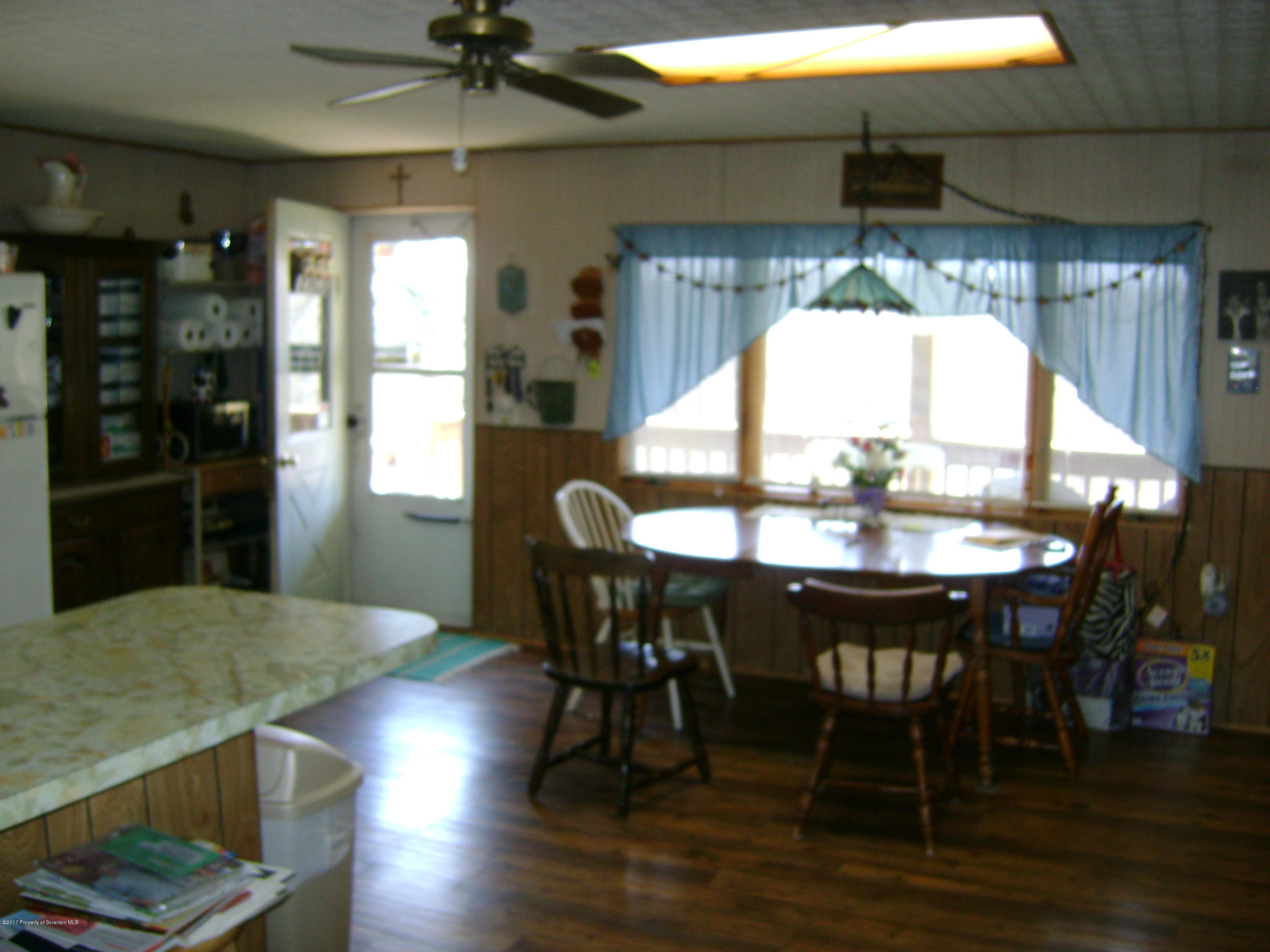 14879 Dimock To Nicholson Road Hop Bottom, PA 18824 - Photo 3 of 21 a view of a dining room with furniture and wooden floor