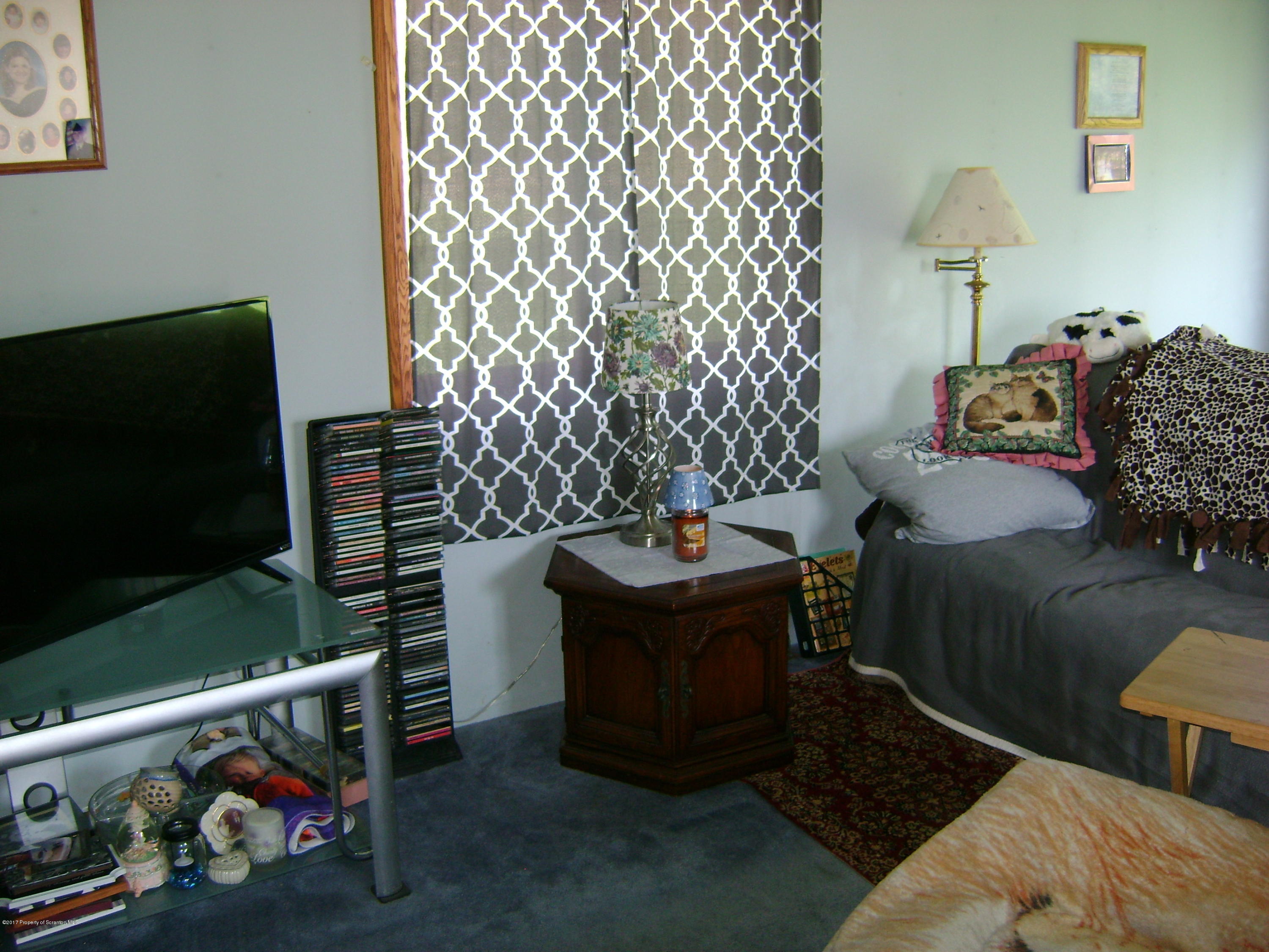 14879 Dimock To Nicholson Road Hop Bottom, PA 18824 - Photo 4 of 21 a living room with furniture and a flat screen tv