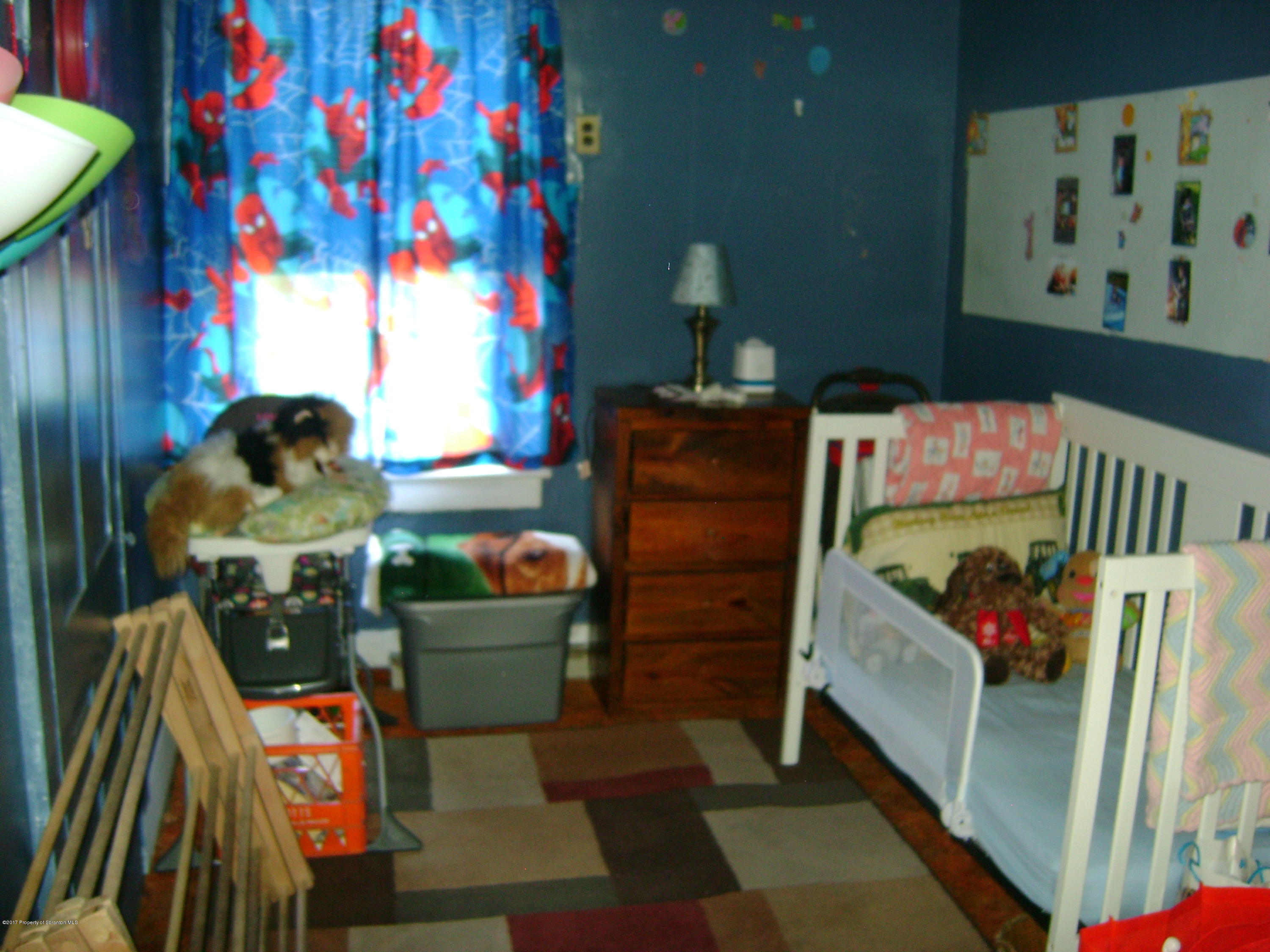 14879 Dimock To Nicholson Road Hop Bottom, PA 18824 - Photo 7 of 21 a bedroom with a bed and a couch