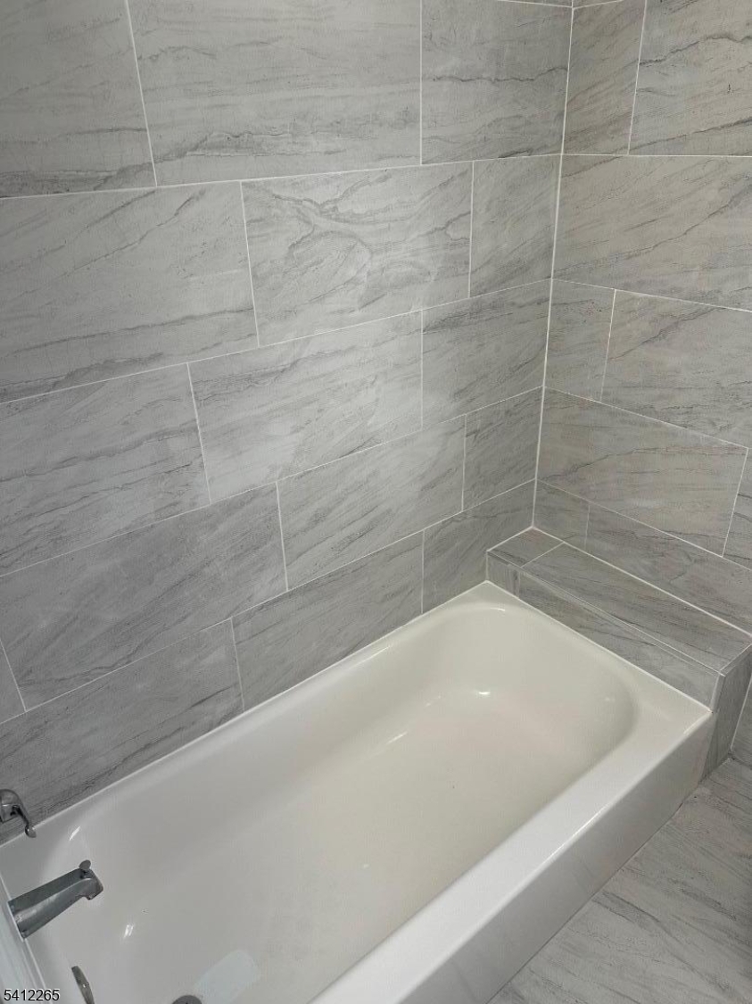 57 Harrison Street Nutley, NJ 07110 - Photo 7 of 8 a bathroom with a bathtub