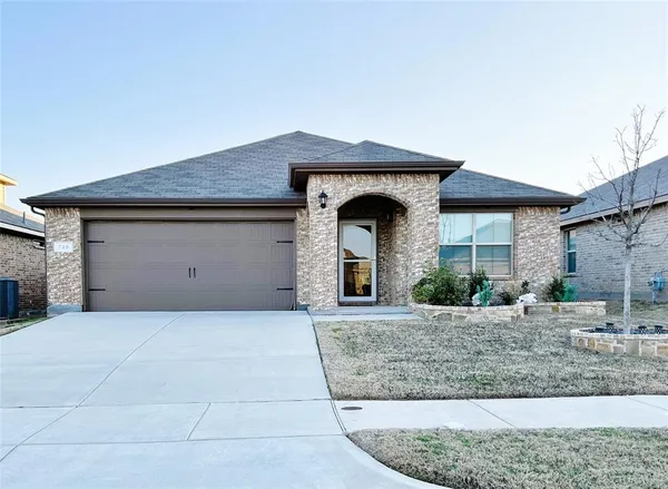 a front view of a house with yard