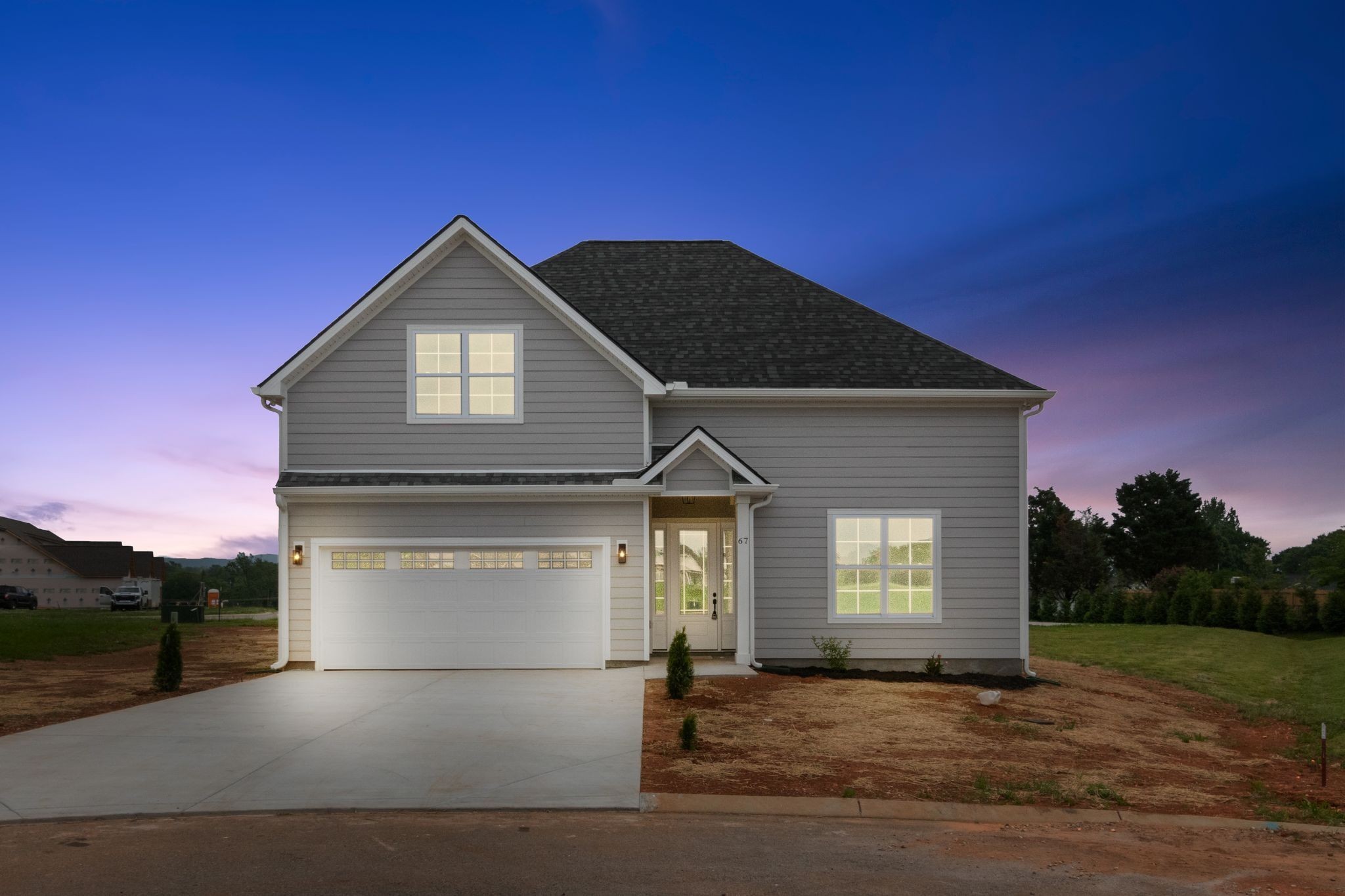 a front view of a house with a yard