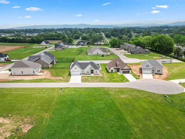 an aerial view of a house with outdoor space