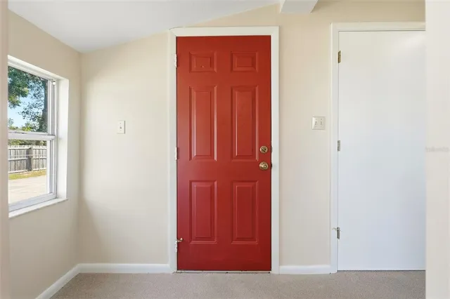 an entryway with wooden floor