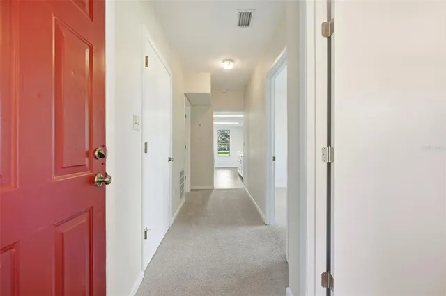 a view of a hallway with two rooms