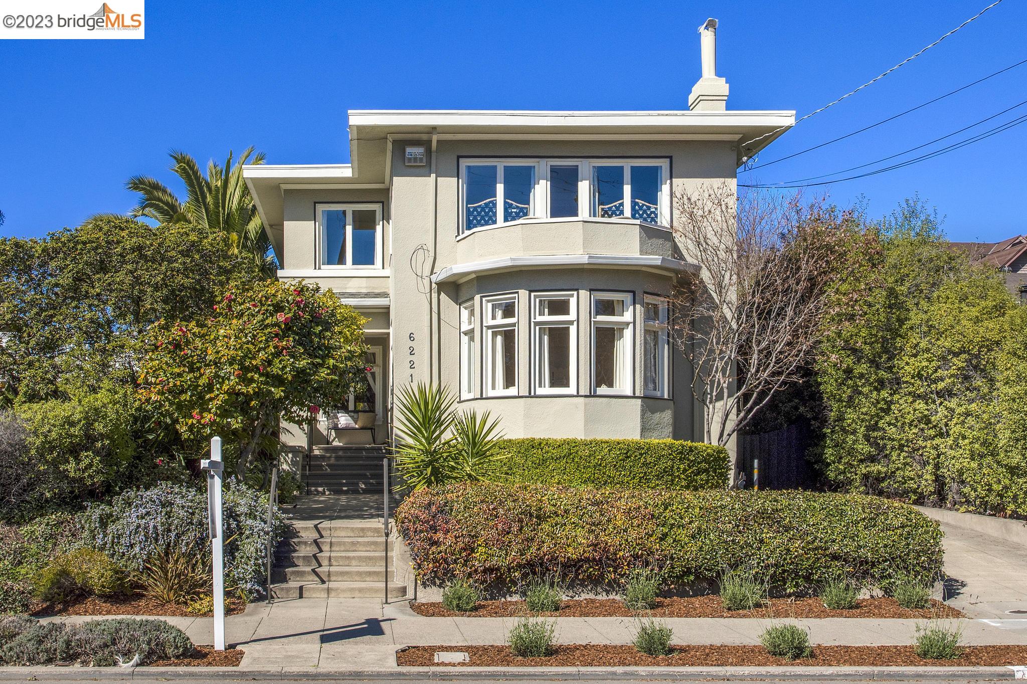 6221 Chabot Road Oakland, CA 94618 - Photo 1 of 1 a front view of a house with garden