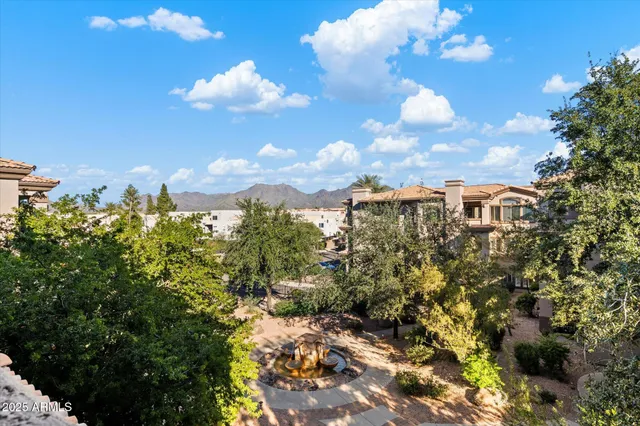 a view of a house with a fountain
