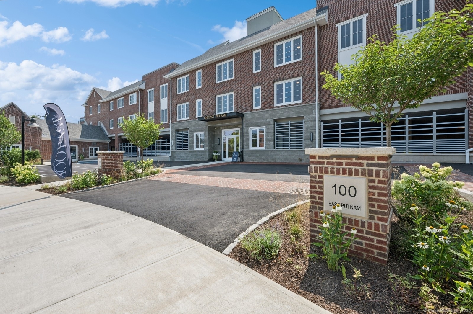 a front view of a building with garden