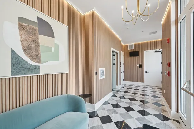 a view of a hallway with windows