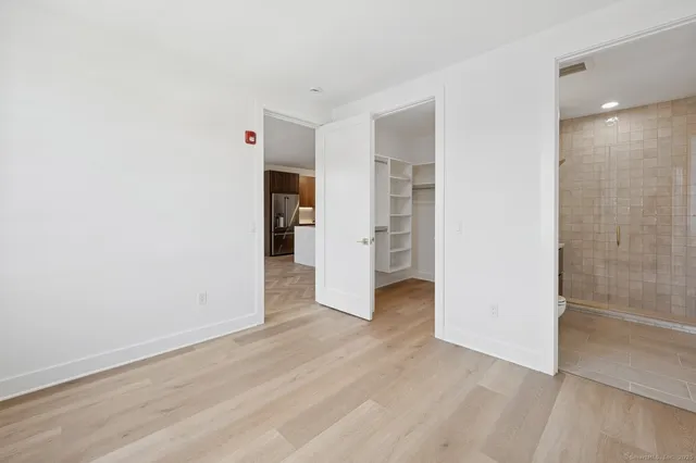 an empty room with wooden floor