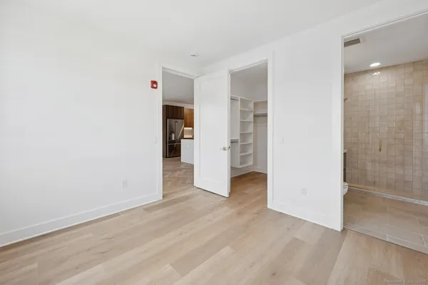 an empty room with wooden floor