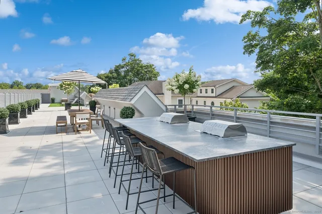 a terrace with a table and chairs