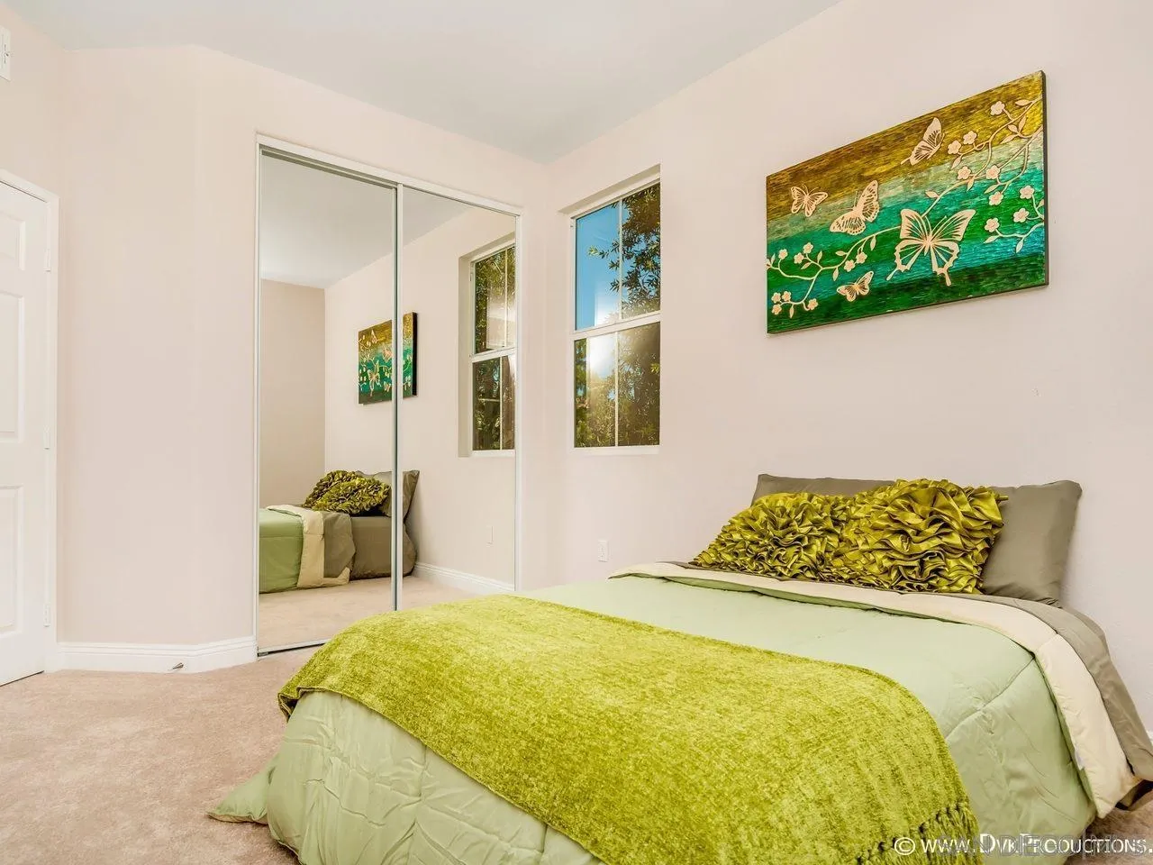 2145 Caminito Elda, Unit 104 Chula Vista, CA 91915 - Photo 7 of 9 a bedroom with a bed and a flat screen tv