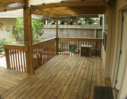 4702 Cedar Pass Drive, Unit E Corpus Christi, TX 78413 - Photo 2 of 5 a view of a balcony with wooden floor