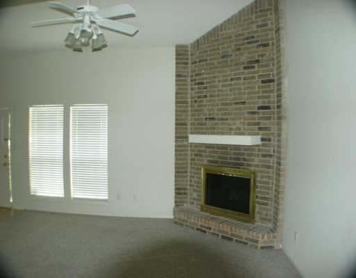 4702 Cedar Pass Drive, Unit E Corpus Christi, TX 78413 - Photo 3 of 5 a view of a livingroom with a fireplace