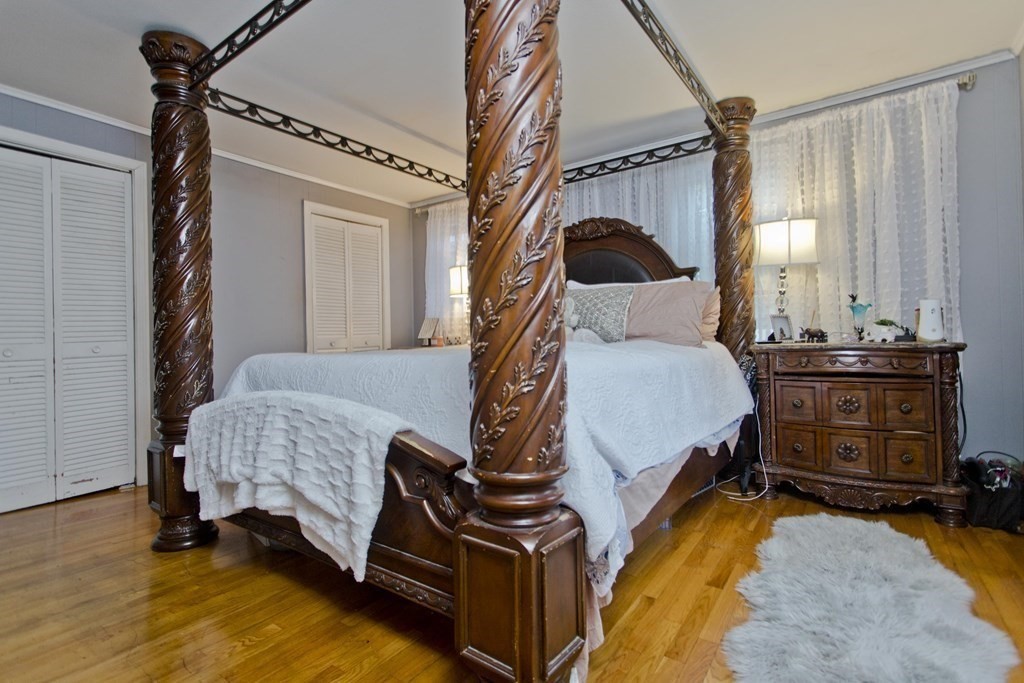 177 Belvidere Street Springfield, MA 01108 - Photo 12 of 24 a bedroom with a bed and a window
