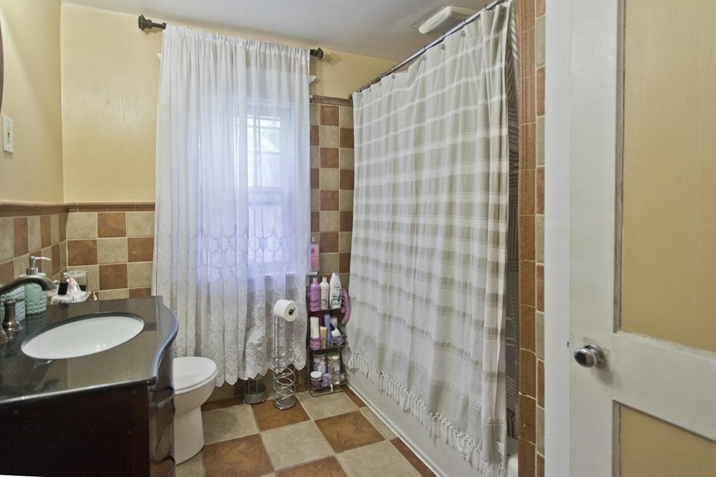 177 Belvidere Street Springfield, MA 01108 - Photo 17 of 24 a bathroom with a sink and mirror