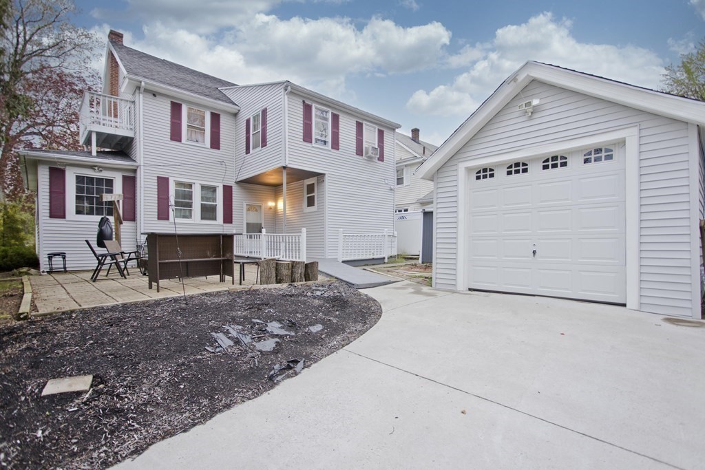 177 Belvidere Street Springfield, MA 01108 - Photo 23 of 24 a front view of a house with a yard