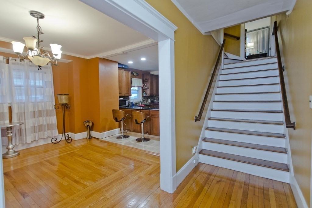 177 Belvidere Street Springfield, MA 01108 - Photo 6 of 24 a view of a room with wooden floor and staircase